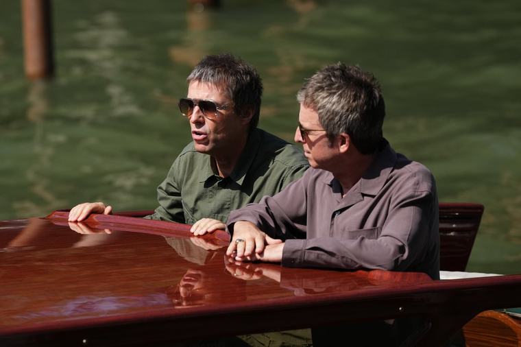 Oasis stars Liam and Noel Gallagher arrive at Venice Film Festival on boat